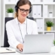 Person working on transcription at a laptop