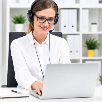 Person working on transcription at a laptop